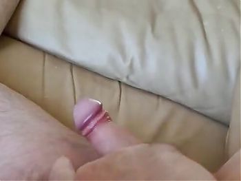 lying on the couch playing with my little cock waiting for a wet pussy or something else good