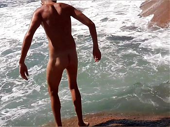 Famous football player is caught pissing on the beach